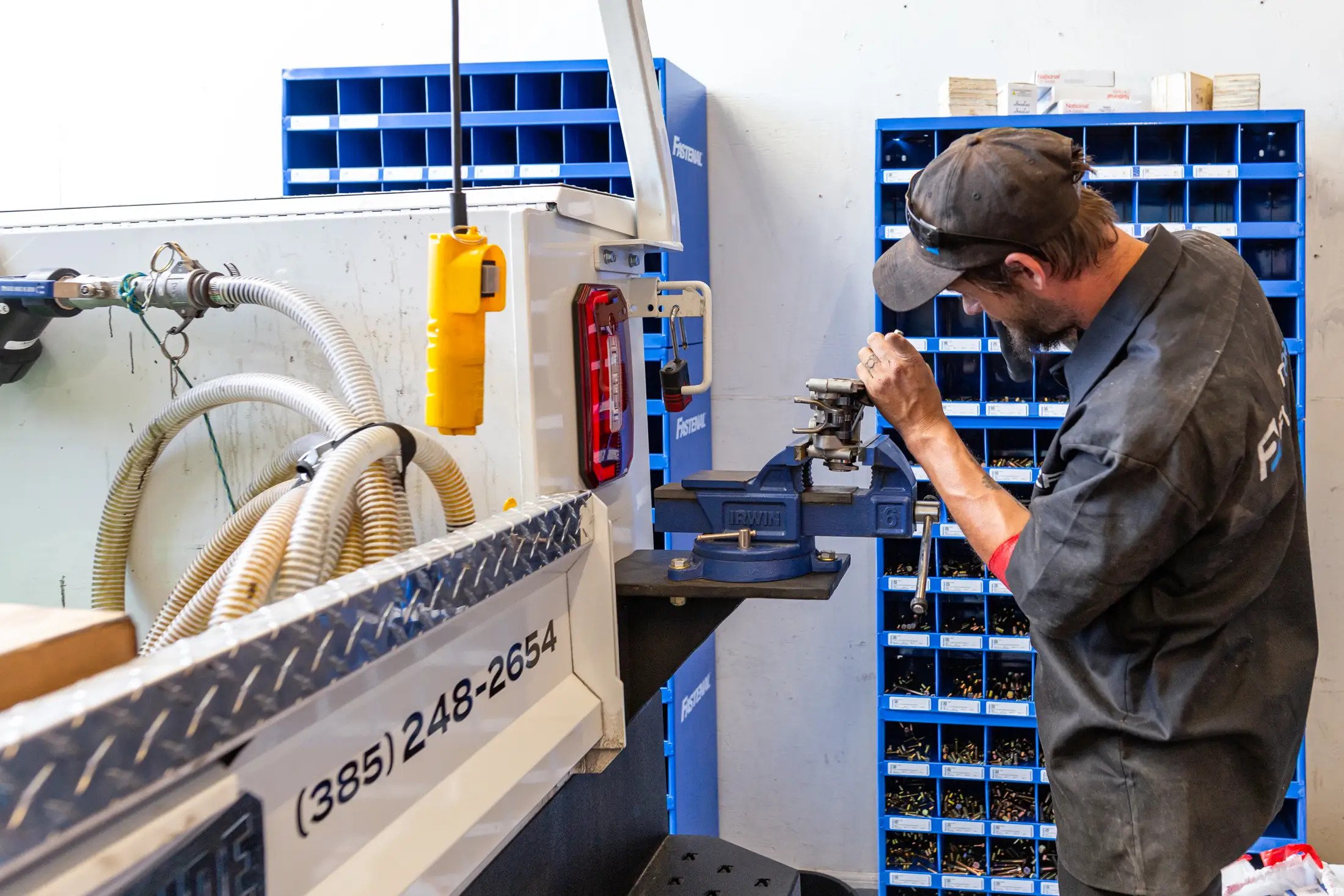 Fleet Pros Auto technician working an engine part